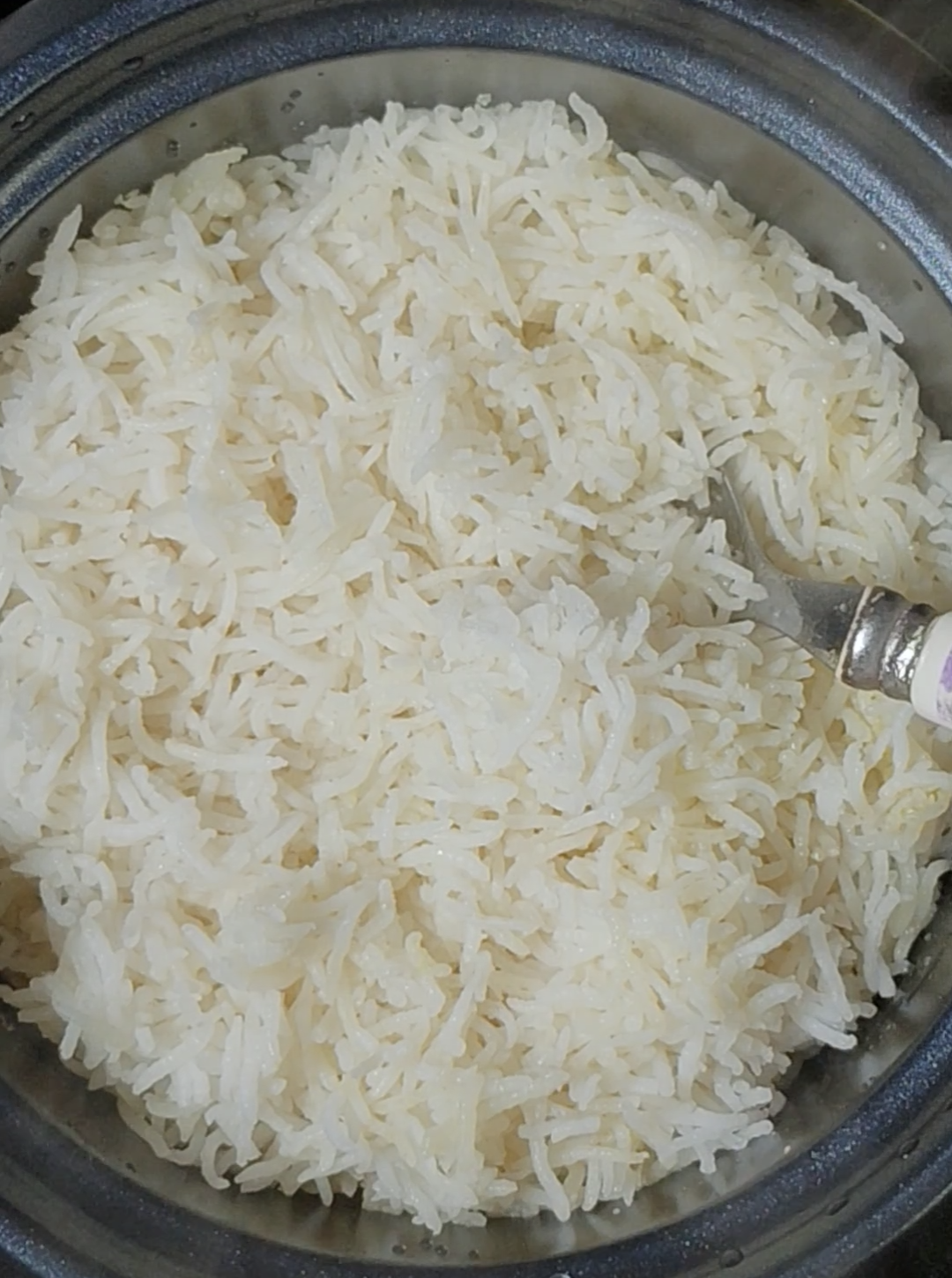 Freshly cooked basmati rice in a rice cooker