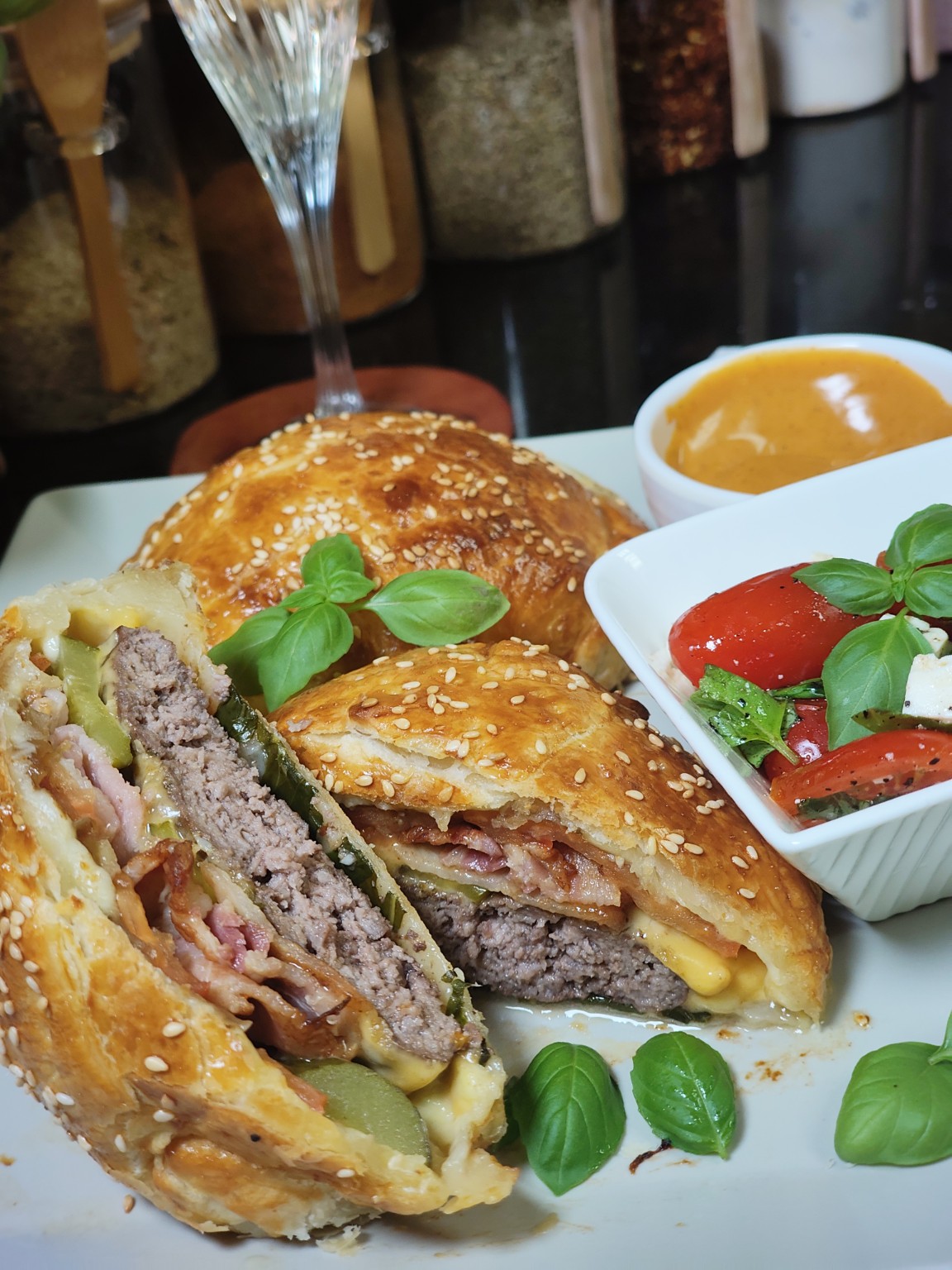 Air Fryer Beef Pastry Burger with sesame-topped golden pastry, one half cut open
