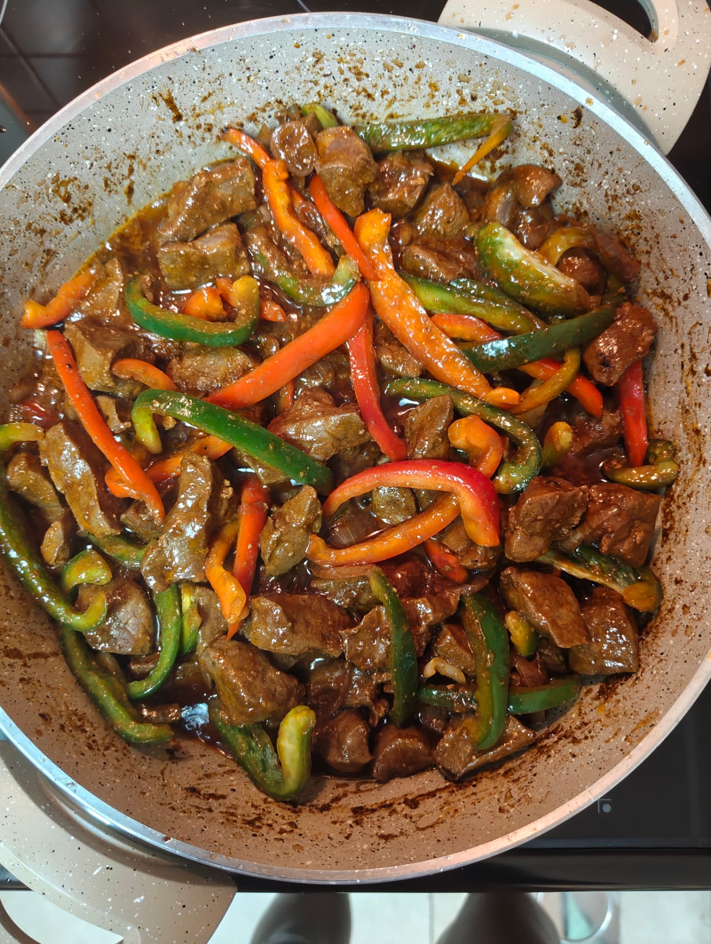 Red and green capsicum added to beef liver stew