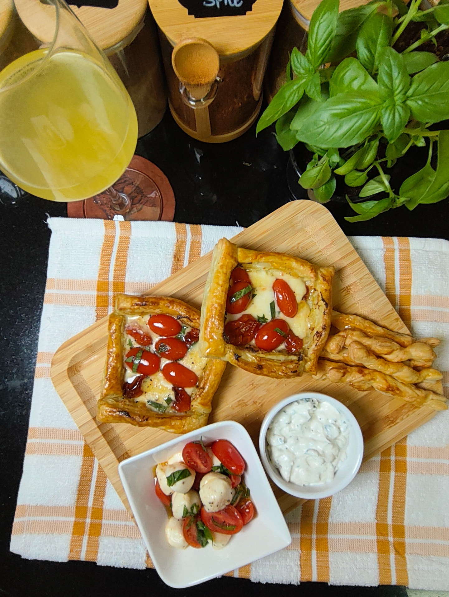 Air fryer pesto tomato and mozzarella puff pastries with Caprese salad