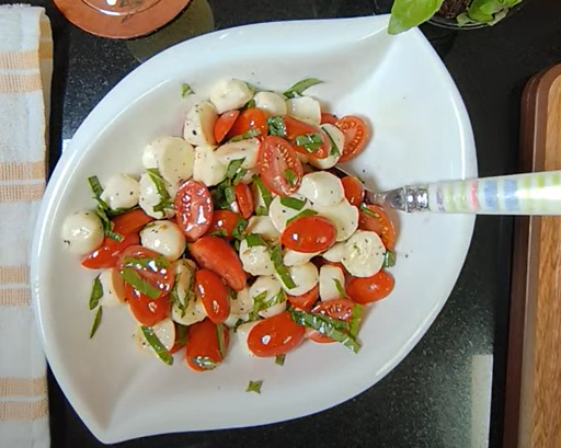 Caprese style salad with cherry tomatoes, fresh mozzarella and basil