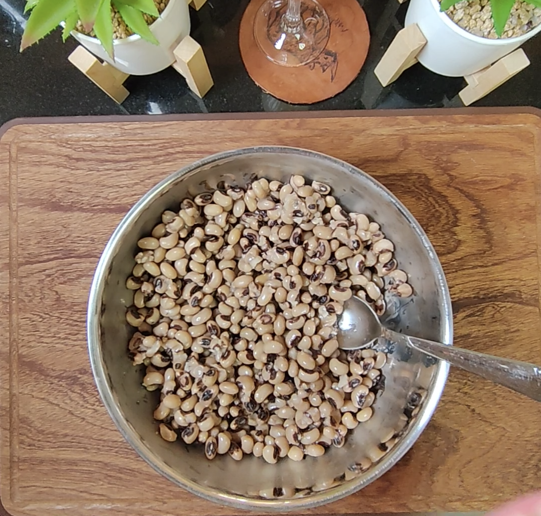 Cooked black eyed peas in a metal bowl ready for the salad