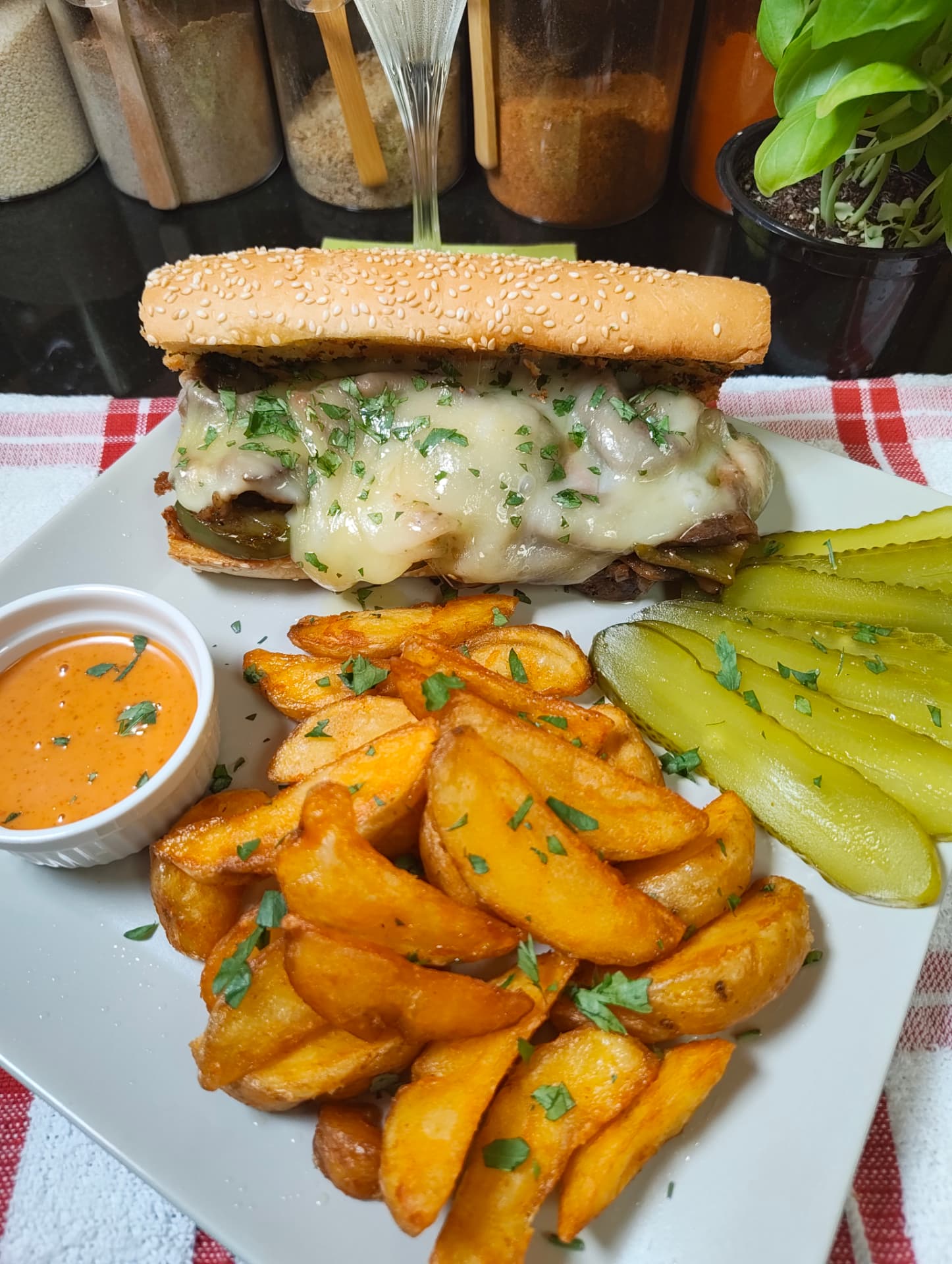 Philly cheesesteak sandwich served with spicy mayo